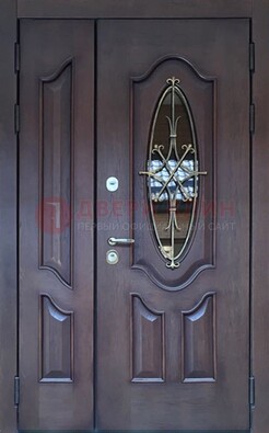 Темная металлическая дверь Винорит со стеклом и ковкой ДСК-239 в Сочи