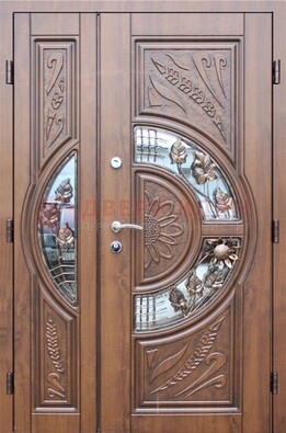 Уличная дверь в цвете Итальянский орех с виноритом и ковкой со стеклом ДВТ-147 в Санкт-Петербурге